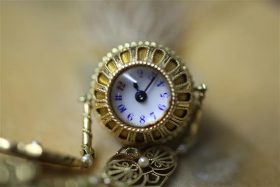 An early 20th century French 18ct gold, guilloche enamel and seed pearl sautoir pendant watch, retailed by Cartier.